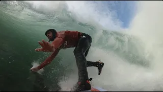 Attempting to paddle into huge waves at Nazare