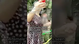 Woman in China takes selfie with body in background