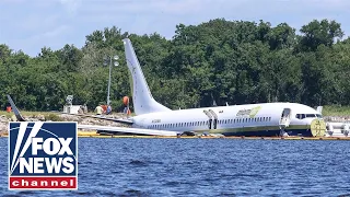 Boeing 737 plane carrying 143 people skids off runway into river