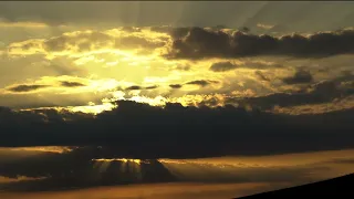 Amazing Movement of Yellow Poisonous Clouds on a Blue Sky at a Fading Sunset