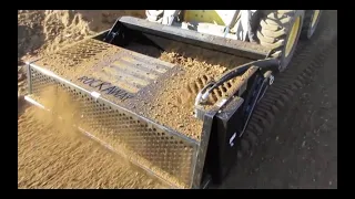 Skid Steer Rock Rake Attachment In Action by Rockaway