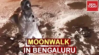 Artist Dressed Up As Astronaut Moonwalks On Potholes In Bengaluru