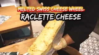 Huge Melted Swiss Raclette Cheese Wheel