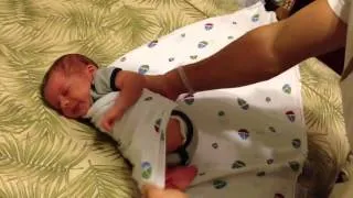 Daddy tucking baby in