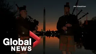 Bagpipers in Washington D.C. mark 100th anniversary of First World War at sunrise