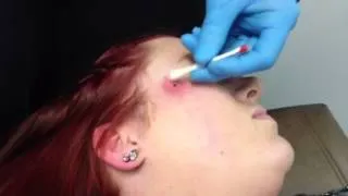 Dermal Piercing on cheek