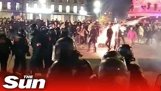 Riot police throw canister that explodes in protester's face in Paris demonstrations