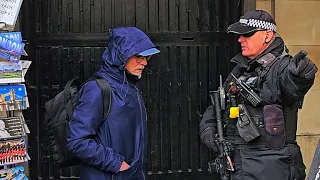 GET OUT! ARMED POLICE OFFICER tells IDIOT TOURIST who doesn't listen at Horse Guards!