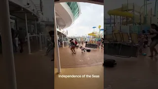 Royal Caribbean cruise ship passengers run for cover as storm batters deck furniture