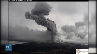 Popocatepetl Volcano near Mexico City topped by column of smoke