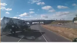 ISP dashcam shows wind gust blowing truck and trailer over on interestate