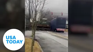 Dramatic moment: Train hits tractor-trailer stuck on crossing in NY | USA TODAY