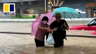 At least 2 dead as Hong Kong residents face once-in-500-years downpour