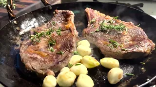 Butter basted steaks, Chanterelles and forging chef tongs