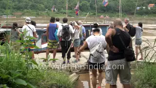 Tourists board Mekong River Cruise to visit Pak Ou Caves in Luang Prabang, Laos