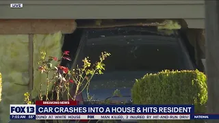 Car crashes into Puyallup home, hits resident