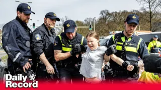 Greta Thunberg detained by police at climate demonstration in The Hague