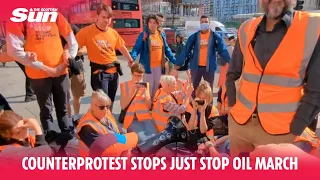 Counterprotest surrounds Just Stop Oil activists and stops them doing a go-slow march