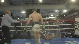 Conor McGregor drops Paulie Malignaggi with a combination.