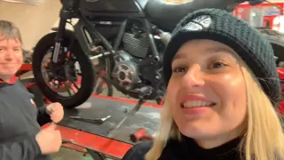 Model in the workshop with her Scrambler Ducati.