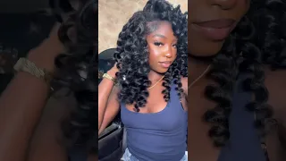 Flip over quick weave using 4 bundles of curly hair blown out, and wand curled￼