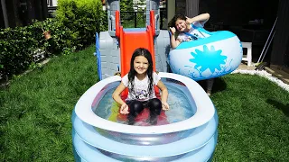 Masal and Öykü with playing fun water slide