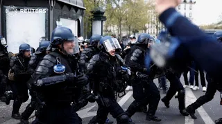 Riot police face off with protesters in Paris