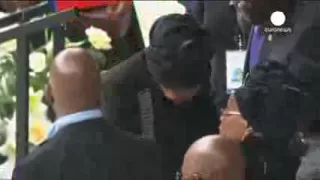 Mandela's widow Graca Machel and ex-wife Winnie's hug at memorial ceremony in Soweto