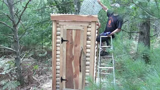 Building an out house from scrap logs