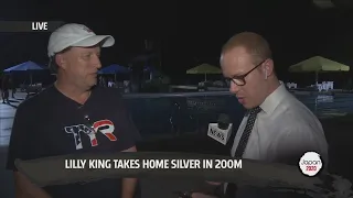 Noah Alatza talks with Lilly King's father after she wins silver