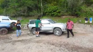 Bone stock Toyota Hilux Surf tackles the mud pit...