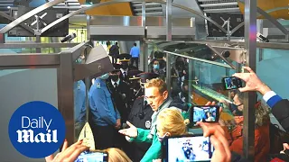 Alexei Navalny is detained by Russian police after landing in Moscow