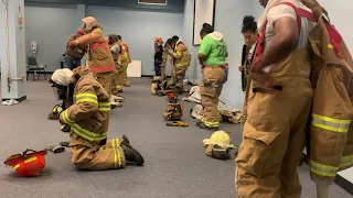 EMS firefighter "donning" exercises at the Metropolitan Career-Technical Center