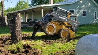 Quick attach stump bucket in action