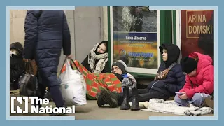 Thousands throng train station in early morning bid to flee Ukraine's capital