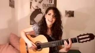 The girl is very beautiful with a guitar singing a song Katy Perry