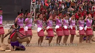 Garo tribal men playing drums while women dance to the beat!