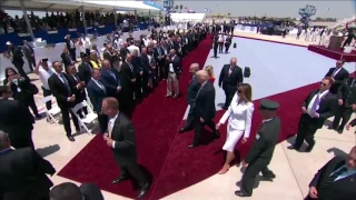 Melania Trump appears to push president’s hand away