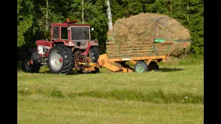 Gathering loose hay with ih 1246 and a self loading wagon.