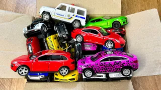 Box full of various miniature cars Jaguar, Peugeot, Renault, Hyundai, Mazda, Volvo, Honda, Opel #624