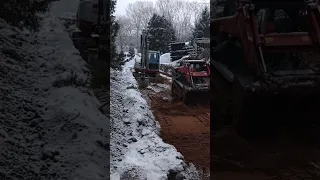 Takeuchi TB290 along with the TB240 and TL6 installing a new septic system.