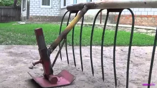 Rake hay under the walk-behind tractor.