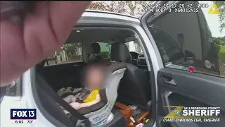 Body camera shows baby being rescued after car stolen from driveway
