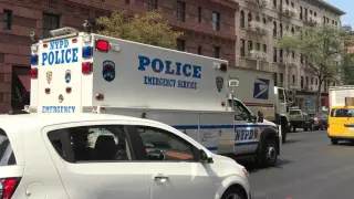 OLDER NYPD ESU TRUCK PATROLLING ON AMSTERDAM AVE. ON THE WEST SIDE OF MANHATTAN IN NEW YORK CITY.