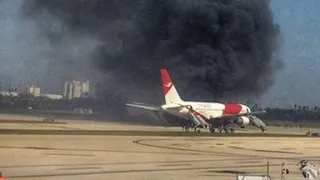 Plane catches fire on runway