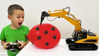 Sofia and Max playing with Toy tractor excavator and Balloons