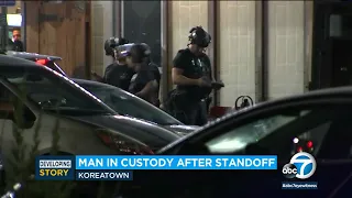 Suspect in custody after being shot by LAPD and barricading in Koreatown building