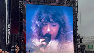 Clairo performs “Amoeba” on the rain at Forecastle music festival 2022