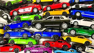 Box full of various miniature cars Jaguar, Peugeot, Renault, Hyundai, Mazda, Volvo, Honda, Opel #002
