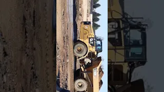 Caterpillar 740B dump truck in mud